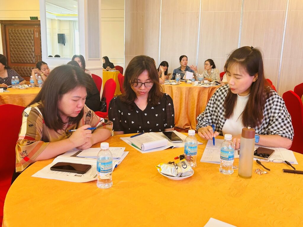 A group of women sitting at a table Description automatically generated